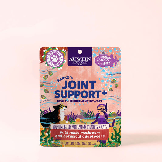 Austin and Kat Joint Support+ Mobility Powder supplement toppers in a jar, showing the powder texture and scoop.